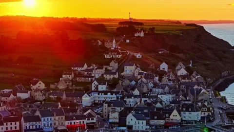 Aerial Drone Sunset Pullback Reveal of Port-en-Bessin Village and Harbor Stock Footage 333311531