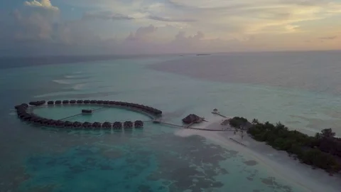 Aerial Drone at Sunset Towards Jacuzzi Water Villas Stock-Footage 80948520