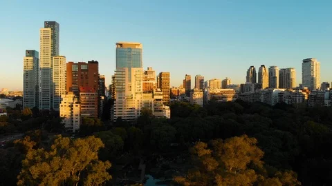 Aerial drone sunset, Tree park and Skyscraper buildings, Palermo, Buenos Aires Stock Footage 100885175