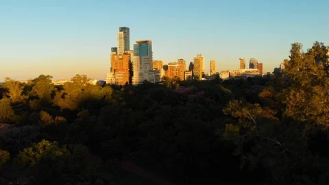 Aerial drone sunset, Tree park and Skyscraper buildings, Palermo, Buenos Aires Stock Footage 100897562