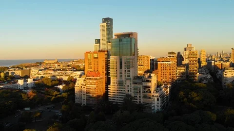 Aerial drone sunset, Tree park and Skyscraper buildings, Palermo, Buenos Aires Stock Footage 100898191