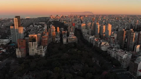 Aerial drone sunset, Tree park and Skyscraper buildings, Palermo, Buenos Aires Stock Footage 100899051