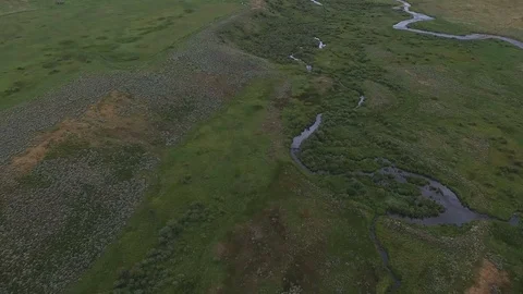 Aerial drone tilt down of mountain valley stream Stock Footage 80358091