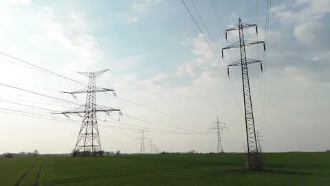 Aerial drone tilt down view of high voltage electricity pylons line Stock Footage 331098379