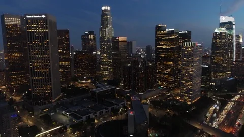Aerial drone tilt up footage of downtown Los Angeles skyline at dusk Stock Footage