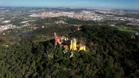 Aerial drone tilting down reveal of Pena Palace, Portugal Stock Footage 220979657