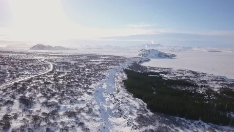 Aerial Drone Tilting Down To Show Snow Covered Winter Rock Valley In Iceland Video stock 87247374