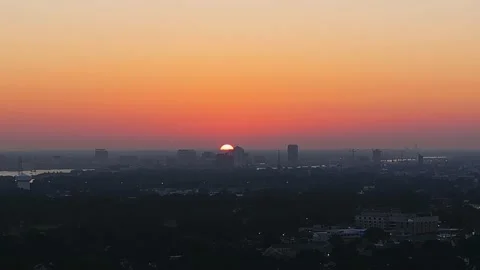 Aerial (drone) time lapse of a sunrise over Portsmouth Virginia Stock Footage