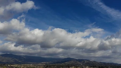 Aerial, Drone, Time-lapse Video of Clouds Over The San Bernardino Mountains Stock Footage 99157663