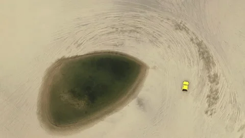 Aerial drone top down of car driving in sand dunes Brazil BR FOR 0368 A GR 動画素材 143284702
