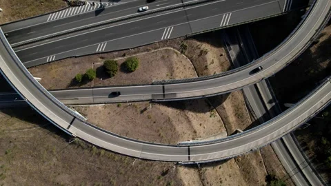 Aerial drone top down cinematic orbit of elevated highway junctions Stock Footage 248709774