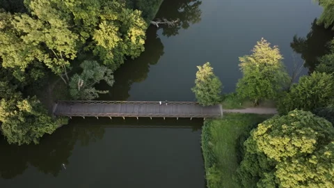 Aerial Drone Top Down Flight Over Park Bridge and River Stock Footage 323769844