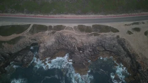 Aerial drone top down hyperlapse of Rugged Coastline and Road in Guincho Stock Footage 279194043