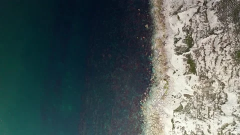Aerial Drone top down over sea cliffs Is... | Stock Video | Pond5