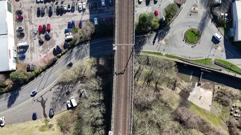 Aerial Drone Top Down of Raised Railway Tracks Moving Forward Urban Town Stock Footage 330333162