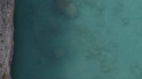 Aerial drone top down shot of two swimmers in Caribbean sea Stock Footage 137500667