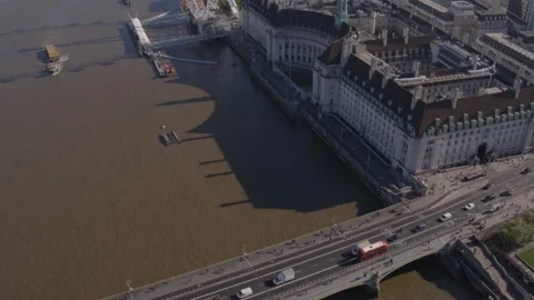 Aerial drone top down shot along Westminster Bridge tilting up to London Eye Stock Footage 230021282