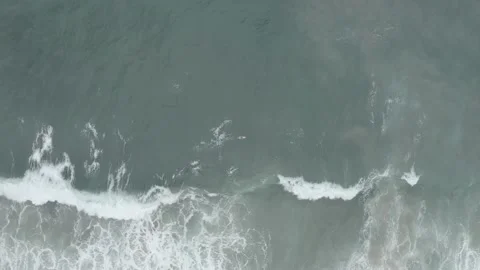 Aerial drone top down of surfer in tropical sea waves zoom in BR UBA DJI 0752 B Stock Footage 140187153