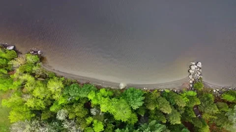 Aerial Drone Top Down Tracking Left Flying Over Lake Shore, Lac Megantic Stock Footage 267796050