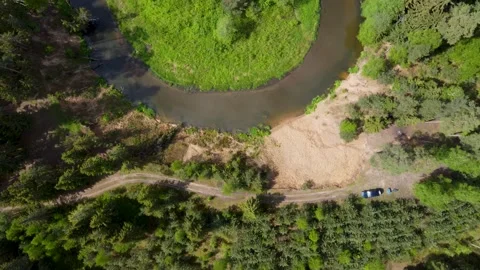 Aerial drone top down video descending over a river u-turn Stock Footage 169929856