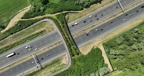 Aerial drone top down video of an ecoduct, an overpass for wildlife, and a Stock Footage 245621765