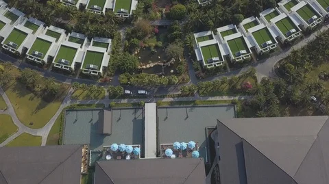 Aerial Drone Top down view of luxurious villas with green roofs surrounded with Stock Footage 128030120