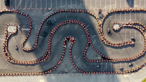 Aerial drone top down view descending over cart lap with people driving carts Stock Footage 170392080