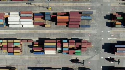 Aerial drone top down view of containers spread across a busy port Stock Footage 212778252