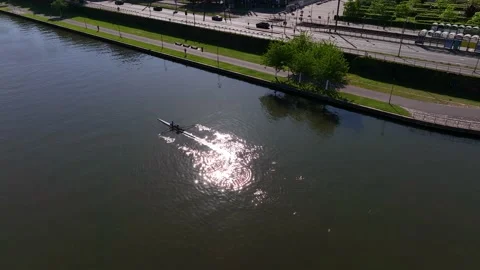 Aerial drone top down view of sport canoe operated by team of trained sailing Stock Footage 232844171