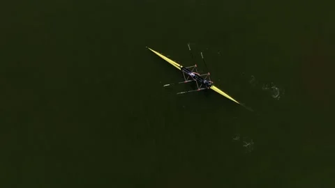 Aerial drone top down view of sport canoe operated by team of young sailing Stock Footage 232844337