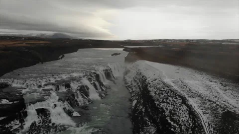 Aerial drone top down view at strong streams of cold blue water from waterfall Stock Footage 233516701