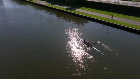 Aerial drone top down view of sport canoe operated by team of trained sailing Stock Footage 237919871