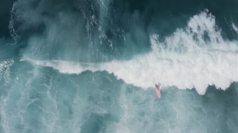 Aerial Drone Top Down view of surfers and wave patterns Stock Footage 242116828