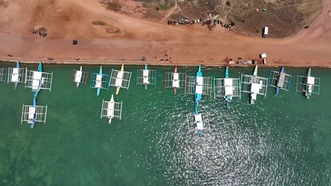 Aerial Drone Top Down View of multiple Filipino Outrigger Bangka Boats Stock Footage 244087029