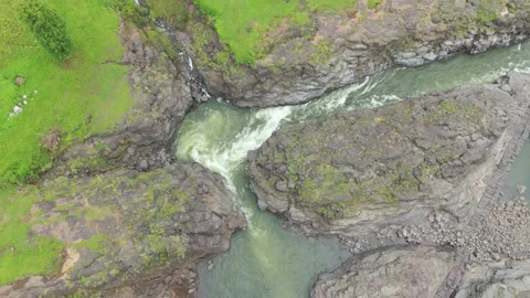 Aerial drone top down view of River milky water, cliffs and rocky area. Stock Footage 285585849