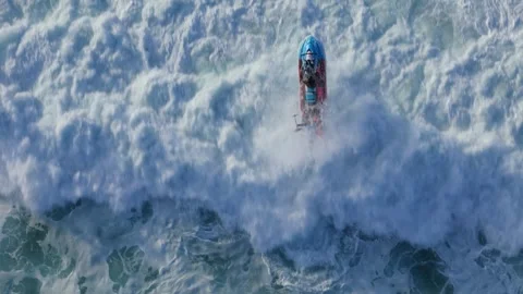 Aerial drone top down view of exciting water sports jet ski action with surfers Stock Footage 295852355