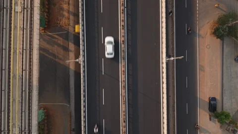 Aerial (Drone) top down view of traffic and metro on flyover in Bengaluru, India Stock Footage 303884170