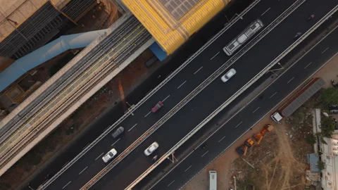 Aerial (Drone) top down view of traffic and metro on flyover in Bengaluru, India Stock Footage 303884379