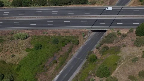 Aerial drone top down view of highway showing vehicle movement Stock Footage 311528230