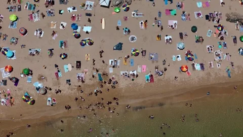 Aerial drone top down view of a crowded beach Stock Footage 312057490
