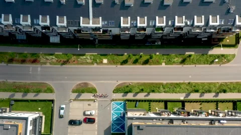 Aerial drone top-down view of suburban street intersection with green landscapin Stock Footage 312593290