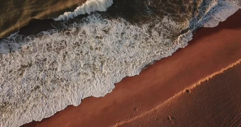 Aerial drone top-down view of ocean waves on Macaé coast, RJ Stock Footage 317730961