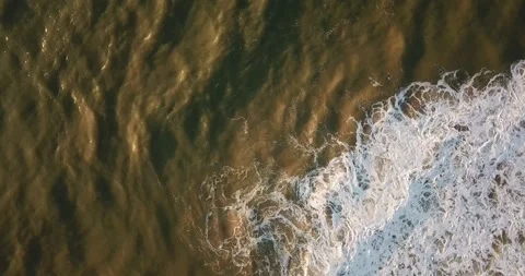 Aerial drone top-down view of ocean waves on Macaé coast, RJ Stock Footage 317731344