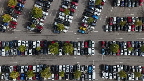 Aerial drone top down view of a parking lot filled with cars Stock Footage 321352955
