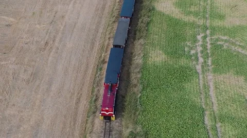 Aerial Drone Top-Down View of Slow Train in Fields Video stock 325812753
