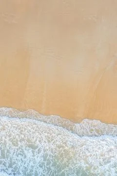 Aerial drone top down view of Abstract of beautiful soft wave come to beach b Stock Photos