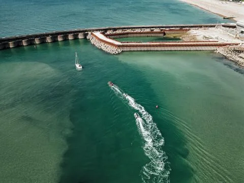 Aerial Drone Top Down View Of Boat In UK Ocean Stock Photos
