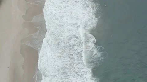 Aerial drone top down of waves breaking on tropical beach BR UBA DJI 0751 A Stock Footage 140187519