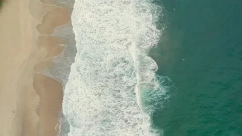 Aerial drone top down of waves breaking on tropical beach BR UBA 0751 A GR Stock Footage 143285648
