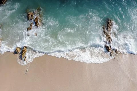 Aerial drone top view crowd of happy people relax at tropical Beach with suns Stock Photos